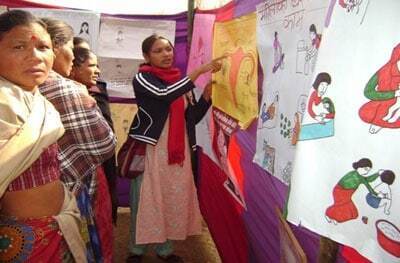 worec_health_counselor A WOREC health counselor sharing information from the Nepali OBOS booklets to women at the health fair / Photo by Jwala Kwolakshyapati, WOREC