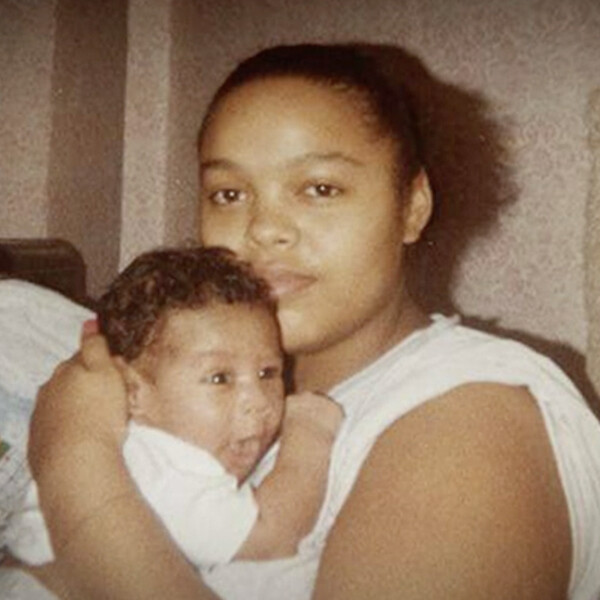A screenshot of a Black woman and baby in front of a written note from the film