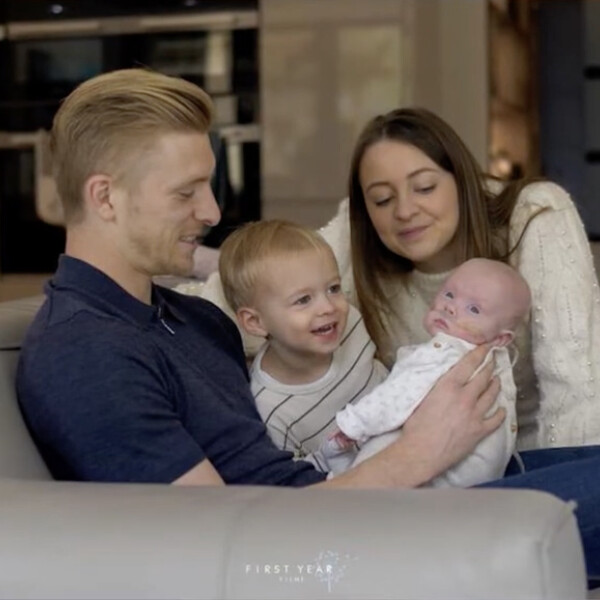 A photo of Ben, Sarah, their toddler son, and their premature baby