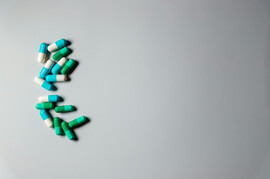 A white background with pills to the left