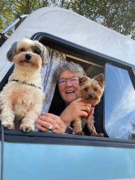 headshot of Laura Barr with dogs Panda and Mookie
