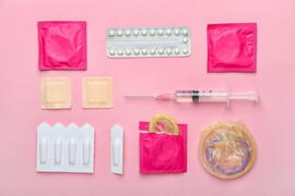 A pink background with different contraceptive methods