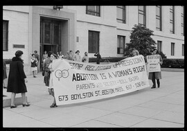 People protesting at a hearing on the abortion amendment