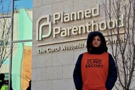 A clinic escort outside the Planned Parenthood - Carol Whitehill Moses Center