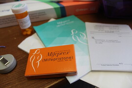 A box of mifepristone and booklets with instructions of how to use it
