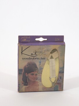 Kotex Wonderform Belt in a purple cardboard box with a cut-out window displaying a white belt against a gold background.