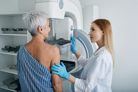 An older woman getting a mammogram