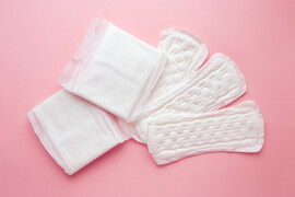 Menstrual pads on a pink background