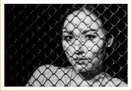 asian-woman-behind-gate