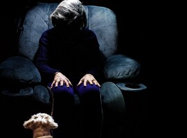 Camellia faceless older woman in chair in dark unsplash scaled jpg