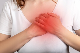 Heart failure woman grabbing chest jpg