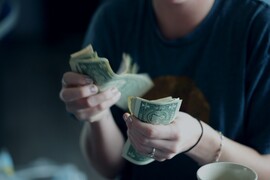 Sharon mccutcheon woman countying money unsplash scaled jpg