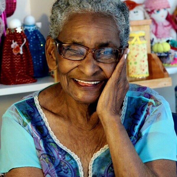 Woman Smiling Leaning on Hand