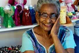 Woman Smiling Leaning on Hand