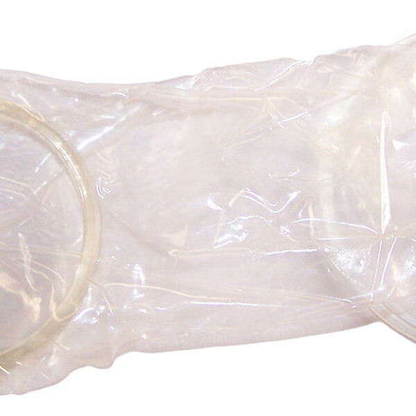 A external condom against a white background.