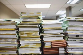 Stacks of files on a table.