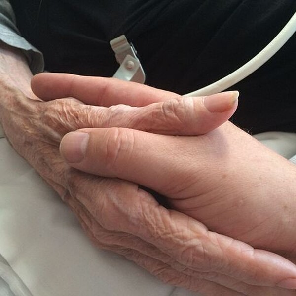 Mother and son holding hands