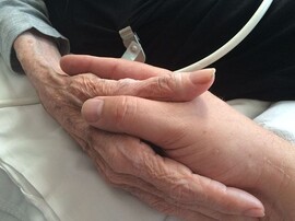 Mother and son holding hands